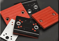 Gripping pads for saw equipment, and hold down pads